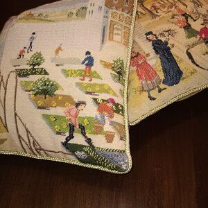 Two embroidered pillows